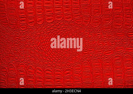 Red crocodile leather texture. Abstract background for design. Stock Photo