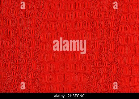 Red crocodile leather texture. Abstract background for design. Stock Photo