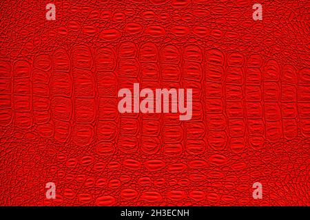 Red crocodile leather texture. Abstract background for design. Stock Photo