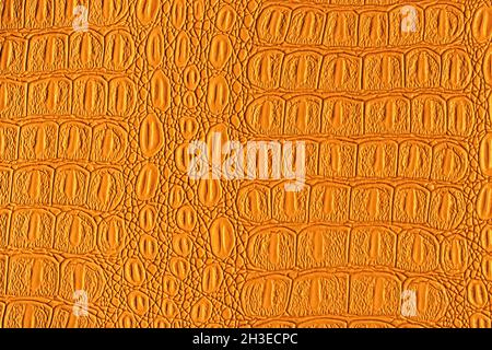 Orange crocodile leather texture. Abstract background for design. Stock Photo