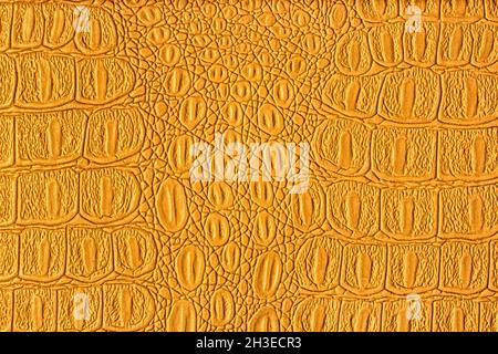 Orange crocodile leather texture. Abstract background for design. Stock Photo