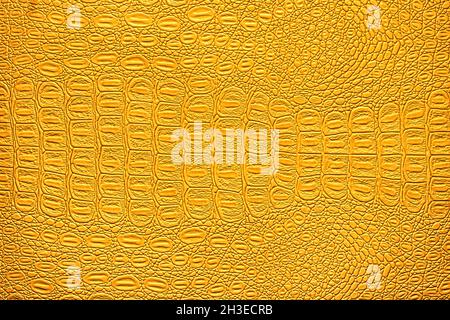 Orange crocodile leather texture. Abstract background for design. Stock Photo