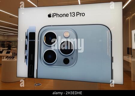 Iphone 13 Pro advertisement in a Rossellimac shop in Malaga, Andalusia, Spain. Stock Photo