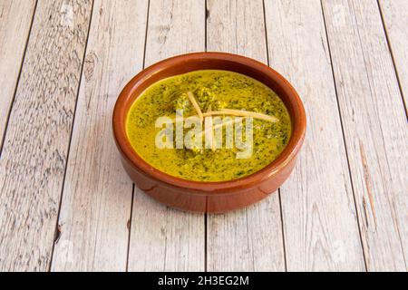 Palak paneer is an Indian cuisine dish consisting of spinach and Paneer cheese in a curry sauce. Palak paneer is a type of Saag, which can also be mad Stock Photo