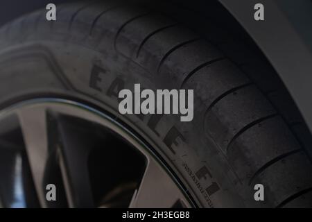 MOSCOW, RUSSIA - JUNE 14, 2021 Goodyear Eagle tire logo on the sidewall of the new tire. The detail of a brand new Goodyear tyre. Stock Photo