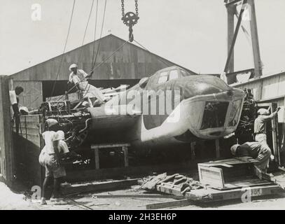 Vintage photo circa 1942 of a Bristol Blenheim light bomber of the RAF being unloaded from a crate prior to the Japanese invasion of Malaya and the fall of Singapore Stock Photo