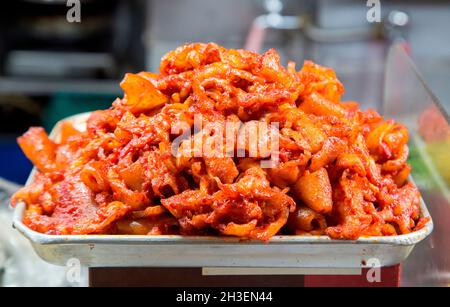 Gwangjang Market, Oct 25, 2021 : Spicy Stir-fried Boneless Chicken Feet at  a food stall at Gwangjang Market in Seoul, South Korea. The market opened  in the early 20th century and it
