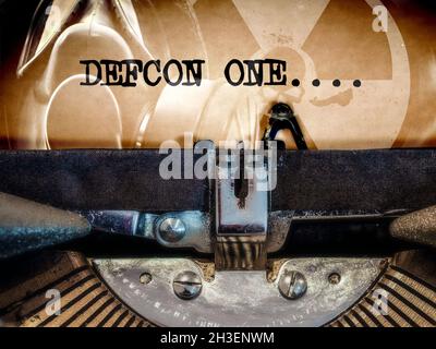Classic Typewriter with DEFCON ONE displayed on an Apocalyptic background Stock Photo
