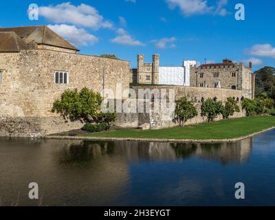 Maidstone, Kent, UK. 28th Oct, 2021. UK Weather: a sunny afternoon with vivid autumn colours at Leeds Castle in Kent. The castle has been partially wrapped in preparation for the annual fireworks display.  Credit: James Bell/Alamy Live News Stock Photo