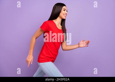 Profile photo of lovely millennial brunette hairdo lady run wear red t-shirt isolated on pastel violet color background Stock Photo