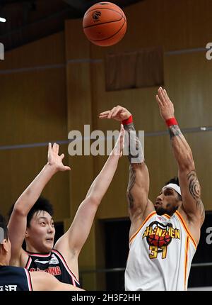 Zhuji, China's Zhejiang Province. 28th Mar, 2021. Darius Adams (R) of ...