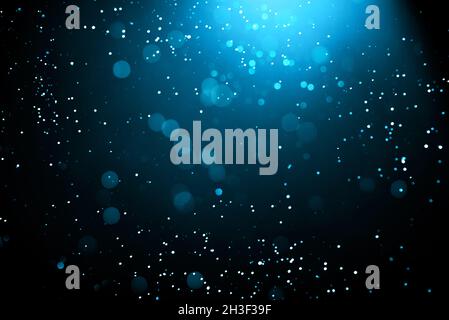 Abstract background with glowing turquoise particles. Stock Photo