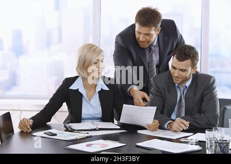Business people reviewing documents Stock Photo