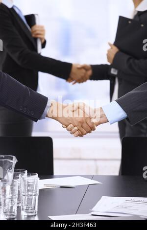 Businesspeople shaking hands Stock Photo