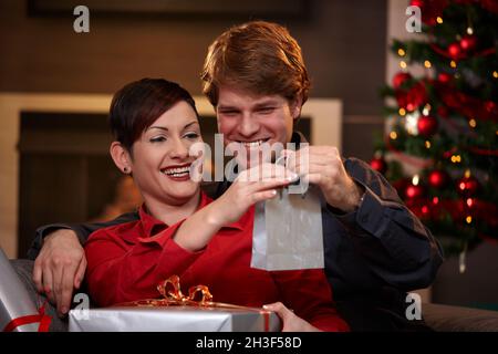 Happy couple holding christmas presents Stock Photo