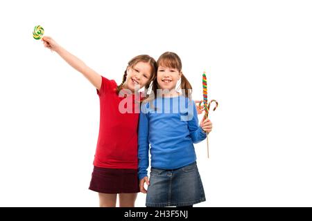 Smiling girls with lollipop Stock Photo