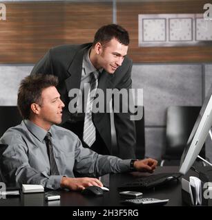 Businessmen working with computer Stock Photo