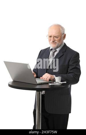 Happy senior businessman using computer Stock Photo