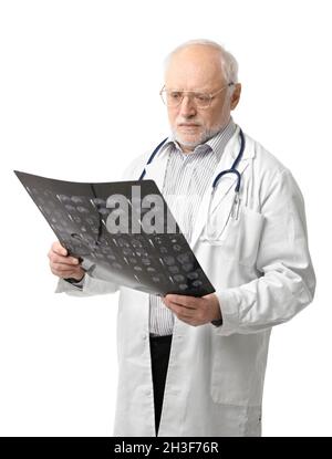 Portrait of senior doctor looking at X-ray image Stock Photo
