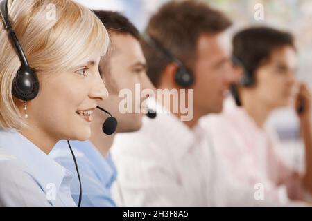 Customer service operators in a row Stock Photo