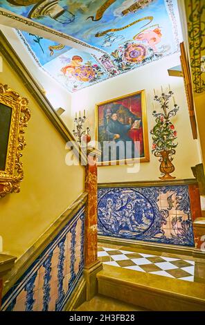 GRANADA, SPAIN - SEPT 27, 2019: The corridor with stairs, located behind the main altar and connecting Sacristy with Camarin chapel, Basilica of  San Stock Photo