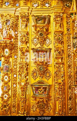 GRANADA, SPAIN - SEPT 27, 2019: The reliquaries behind the main altar of San Juan de Dios Basilica, on Sept 27 in Granada Stock Photo
