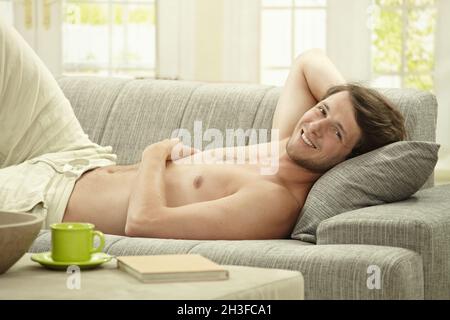 Young man resting at home Stock Photo