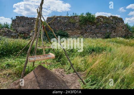Sieve for sifting soil and artifacts. Archaeological excavations, archaeologists work. Stock Photo