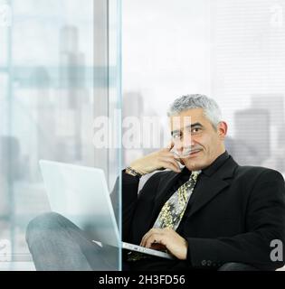 Businessman using laptop Stock Photo