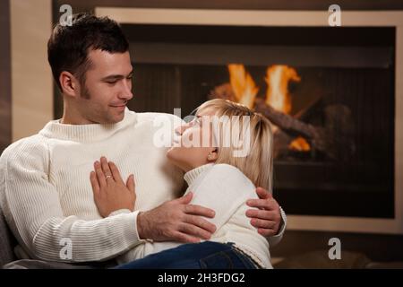 Couple hugging home Stock Photo
