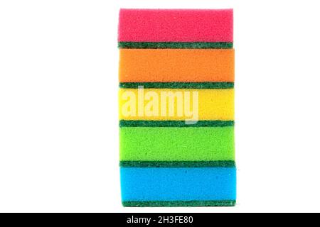 multicolored sponges for washing dishes in a stack on a white background Stock Photo