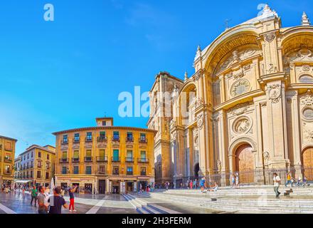 GRANADA, SPAIN - SEPTEMBER 27, 2019: Panorama of the old Plaza de las Pasiegas with historic townhouses and the ornate Granada Cathedral, on September