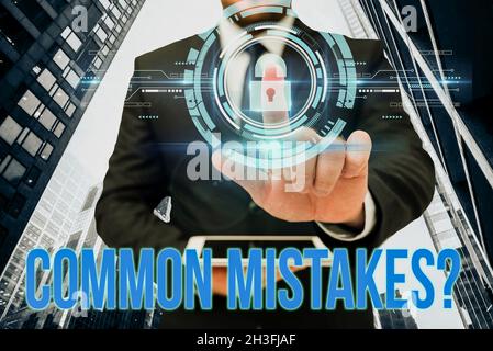 Handwriting text Common Mistakes Question. Word for repeat act or judgement misguided making something wrong Hand Touching Screen Of Mobile Phone In Stock Photo