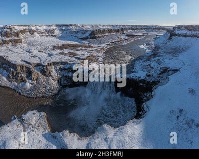 Hafragilsfoss waterfall with snow in autumn aerial view, Iceland Stock Photo