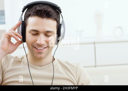 Man listening music with headphones Stock Photo