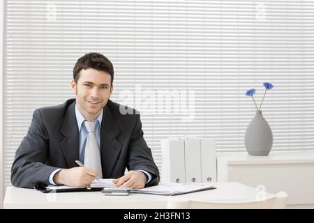 Businessman working at desk Stock Photo