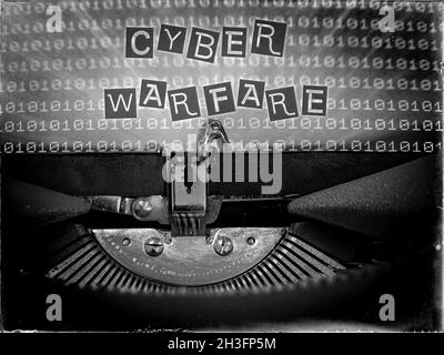 Typewriter displaying Cyber Warfare Stock Photo