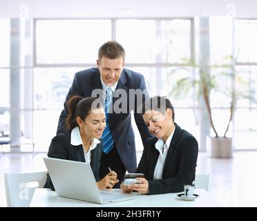 Casual meeting in office lobby Stock Photo