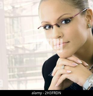 Young businesswoman thinking Stock Photo