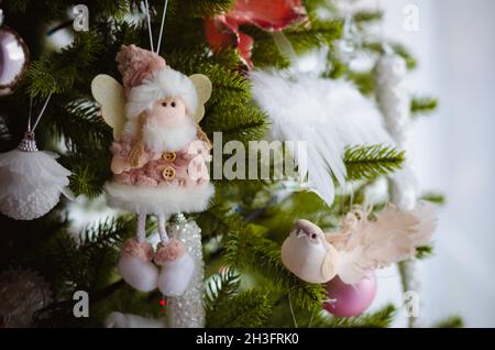 rich and elegant christmas adornments and decoration on tree, figures and muppets Stock Photo