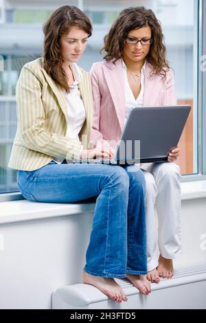 Businesswomen working on computer Stock Photo
