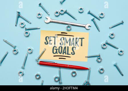 Conceptual caption Set Smart Goals. Business overview giving criteria to guide in the setting of objectives Maintenance Tools And Equipments Mechanic Stock Photo