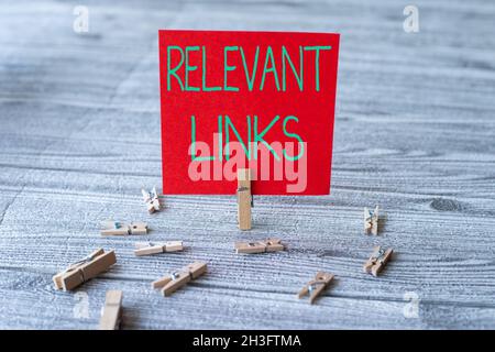 Hand writing sign Relevant Links. Business concept Significant sites for a particular topic Associated Piece Of Blank Square Note Surrounded By Stock Photo