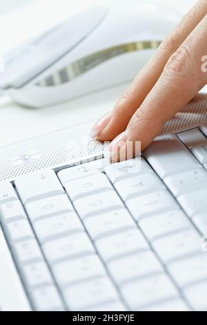 human fingers on the notebook keyboard 3 Stock Photo - Alamy