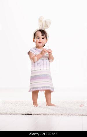 Baby girl with easter eggs Stock Photo