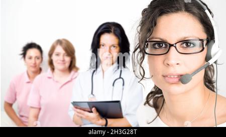 Clinic receptionist in headset Stock Photo