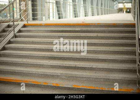 Stairs in the pedestrian crossing. Steps made of stone. A place to lift people on foot. Stock Photo
