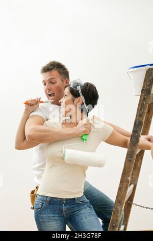 Happy couple painting Stock Photo