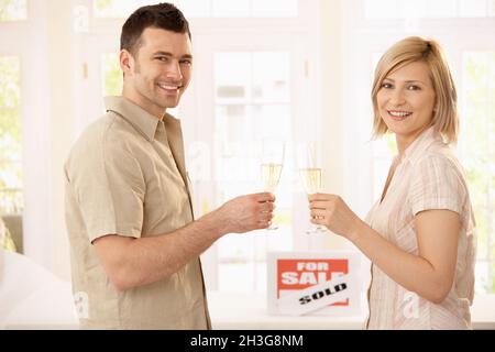 Couple celebrating new house Stock Photo