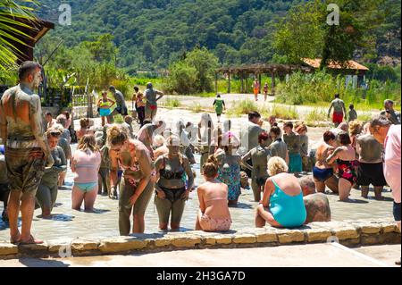 DALYAN, TURKEY-JUNE 21, 2018: Tourists enjoy mud baths near the town of Dalyan, Mugla Province. Stock Photo